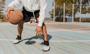 front-view-young-man-playing-basketball-outside